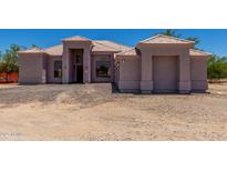 Stunning one story home boasting a well-maintained landscape, desert surroundings and tile roof at 19621 W Minnezona Ave, Litchfield Park, AZ 85340