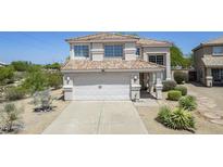 Charming two-story home with a tile roof, desert landscaping, and a spacious two-car garage at 31259 N 42Nd Pl, Cave Creek, AZ 85331