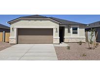 Charming single-story home showcasing a well-manicured yard and neutral color palette at 35512 N Common Ct, San Tan Valley, AZ 85140