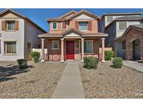 Charming two-story home with a welcoming front porch and gravel landscaping at 6843 S 9Th Ave, Phoenix, AZ 85041