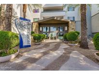 Welcoming building entrance with lush landscaping, modern signage, and direct access to the facilities at 945 E Playa Del Norte Dr # 4019, Tempe, AZ 85288