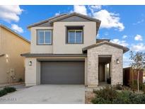 Charming two-story home featuring a two-car garage, stone accents, and well-maintained landscaping at 10013 E Trent Ave, Mesa, AZ 85212