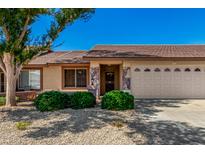 Charming single-story home with stone accents, desert landscaping and a two-car garage in a sunny neighborhood at 11360 E Keats Ave # 92, Mesa, AZ 85209