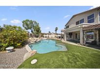 A pristine pool and outdoor living space provide the perfect backdrop for relaxation and outdoor entertaining at 13160 W Windsor Ave, Goodyear, AZ 85395
