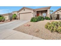 Charming single-story home with desert landscaping, a spacious driveway, and a welcoming front entrance at 15634 S 31St St, Phoenix, AZ 85048