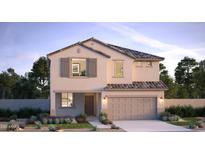 Charming two-story home boasting a stucco facade, two-car garage, and tidy front yard with desert landscaping at 17074 W Seldon Ln, Waddell, AZ 85355
