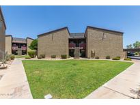 Inviting apartment complex showcasing well-maintained lawns and convenient access to units at 1730 W Emelita Ave # 2033, Mesa, AZ 85202