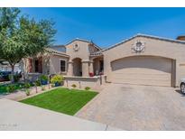 Charming single-story home with a two-car garage, landscaped front yard and welcoming front porch at 22851 S 229Th Pl, Queen Creek, AZ 85142