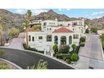 Elegant multi-level home featuring a red tile roof and a well-manicured lawn in a beautiful neighborhood at 3800 E Lincoln Dr # 54, Phoenix, AZ 85018