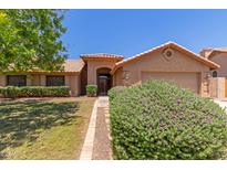 Charming single-story home showcasing manicured landscaping and a welcoming front entrance at 408 W Stacey Ln, Tempe, AZ 85284
