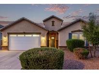 Charming single-story home featuring a well-manicured yard, a two-car garage, and inviting front entrance at 2236 W Aston Dr, San Tan Valley, AZ 85144