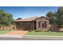 Charming single-Gathering home with brick driveway, two-car garage and beautiful stone accents at 3123 S 155Th Ln, Goodyear, AZ 85338