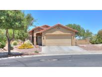 Charming single-story home featuring a xeriscaped front yard and a spacious two-car garage at 103 S Birdie Way, Casa Grande, AZ 85194
