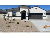 Charming single-story home featuring a two-car garage and low-maintenance desert landscaping at 1162 S Mullberry St, Florence, AZ 85132