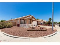 Charming single-story home with well-maintained landscaping, decorative fountain, and a two-car garage at 1943 E San Tan St, Chandler, AZ 85225
