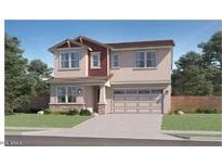 Inviting two-story home with a well-manicured lawn and a spacious two-car garage at 8323 E Peterson Ave, Mesa, AZ 85212