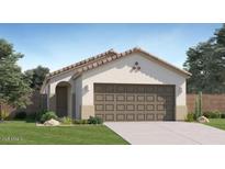 Inviting single-story home with a two-car garage and a neatly landscaped front yard at 12469 E Verbina Ln, Florence, AZ 85132