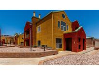 Eye-catching multi-colored townhome exterior with stone landscaping and inviting front entrance at 154 W 5Th St # 210, Tempe, AZ 85281