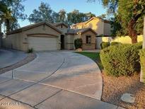 Charming single-story home featuring an attached garage and well-manicured front yard at 1970 W Park Pl, Chandler, AZ 85224