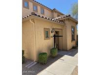 Charming two-story home with stucco siding, decorative tile roof, and tidy landscaping at 21136 N 36Th Pl, Phoenix, AZ 85050