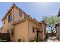 Charming stucco home with a tile roof, manicured landscaping, and a welcoming entrance at 21136 N 36Th Pl, Phoenix, AZ 85050