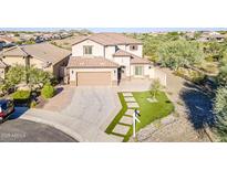 Beautiful two-story home featuring a well-manicured lawn and a two car garage in a desirable neighborhood at 25155 N 108Th Ave, Peoria, AZ 85383