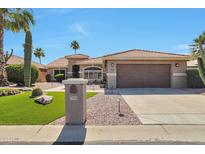Charming single-story home with well-maintained landscaping, desert plants, and a two-car garage at 2984 N 152Nd Dr, Goodyear, AZ 85395
