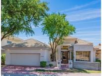 Inviting single-story home with a desert landscape, a two-car garage, and a tile roof at 3153 E Sierra Vista Dr, Phoenix, AZ 85016