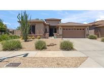 Charming single-Gathering home with desert landscaping and a two-car garage at 35402 N 32Nd Dr, Phoenix, AZ 85086