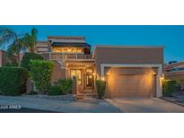 Charming two-story home with attached two car garage, desert landscaping and a cozy balcony at 11025 N 10Th St, Phoenix, AZ 85020