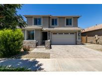 Beautiful two-story home with a well-manicured front yard and a two-car garage at 20926 E Longwood Dr, Queen Creek, AZ 85142