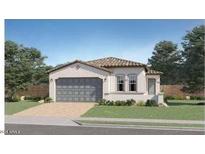 Charming single-story home featuring a tile roof, two-car garage, and manicured landscaping at 23345 W Mobile Ln, Buckeye, AZ 85326