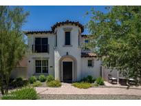 Charming two-story home featuring unique turret architecture, mature landscaping, and a welcoming front entrance at 29431 N 122Nd Gln, Peoria, AZ 85383