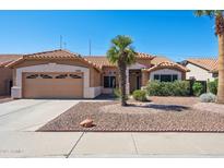 Charming single-story home featuring a low-maintenance desert landscape and a two-car garage at 3133 E Redwood Ct, Phoenix, AZ 85048