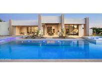 Inviting pool featuring lights and a modern design, seamlessly blending indoor and outdoor living spaces at 6702 E Cholla St, Scottsdale, AZ 85254