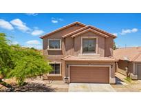 Charming two-story home featuring a tile roof, two-car garage, and well-maintained landscaping under a bright, sunny sky at 6712 W Northview Ave, Glendale, AZ 85303