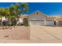Beautiful single-story home with a three-car garage and mature landscaping in a well-maintained neighborhood at 1213 W Beck Ln, Phoenix, AZ 85023