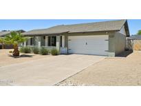 Charming single-story home with a well-maintained front yard and a two-car garage at 13842 N 40Th Ave, Phoenix, AZ 85053