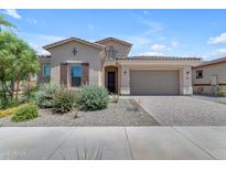 Charming single-story home with desert landscaping, a paver driveway, and a two-car garage at 22788 E Orion Way, Queen Creek, AZ 85142