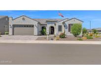 Attractive single-story home featuring a front yard with desert landscaping at 27667 W Mohawk Ln, Buckeye, AZ 85396