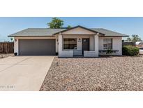Charming single-story home features a well-maintained front yard, gray garage door, and inviting entrance at 343 W Santa Cruz Dr, Tempe, AZ 85282