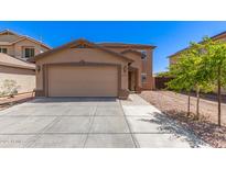 Charming two-story home featuring a spacious two-car garage and well-maintained landscaping at 6033 W Wood St, Phoenix, AZ 85043