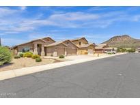 Charming single Gathering homes featuring desert landscaping and convenient two-car garages at 6602 W Lariat Ln, Phoenix, AZ 85083