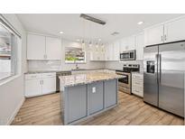 Beautiful kitchen featuring stainless steel appliances, granite countertops, and a central island with pendant lights at 1017 S Allen --, Mesa, AZ 85204