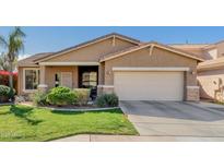 Charming single-story home with desert landscaping, two-car garage, and neutral stucco exterior at 10359 E Jacob Ave, Mesa, AZ 85209