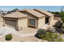 Well-maintained single-story home with desert landscaping and a two-car garage at 14822 N Tonya Cir, El Mirage, AZ 85335