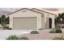 Charming single-story home with a neutral color palette, large garage, and drought-tolerant landscaping at 17270 W Paraiso Ln, Surprise, AZ 85387