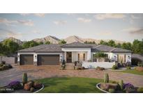 Stunning desert home with a three-car garage and professionally landscaped front yard at 1785 W Brooke Ln, Queen Creek, AZ 85144