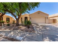 Charming single-story home with desert landscaping and a two-car garage at 18812 N 90Th Pl, Scottsdale, AZ 85255