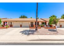 Charming single-story home featuring a two-car garage, easy-care landscaping, and brick accents at 2105 S Zinnia Ave # 468, Mesa, AZ 85209
